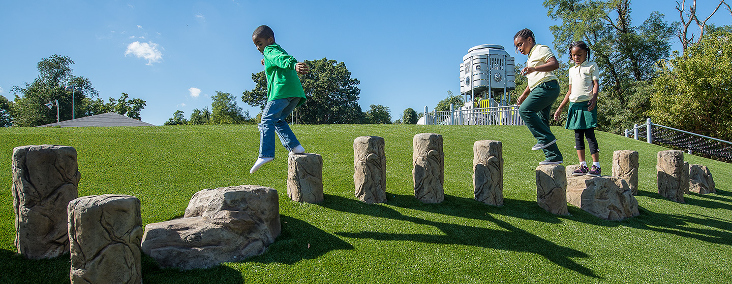 Children playing on GFRC rock steppers